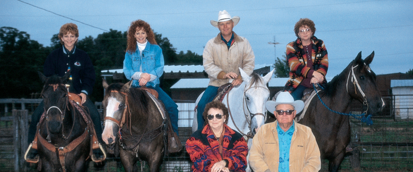 Reba and family on horseback 